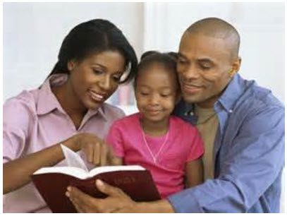 photo of preschooler reading with parents