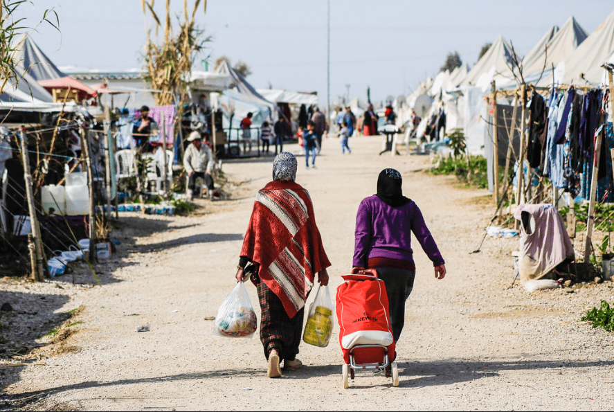 Refugees walking in camp