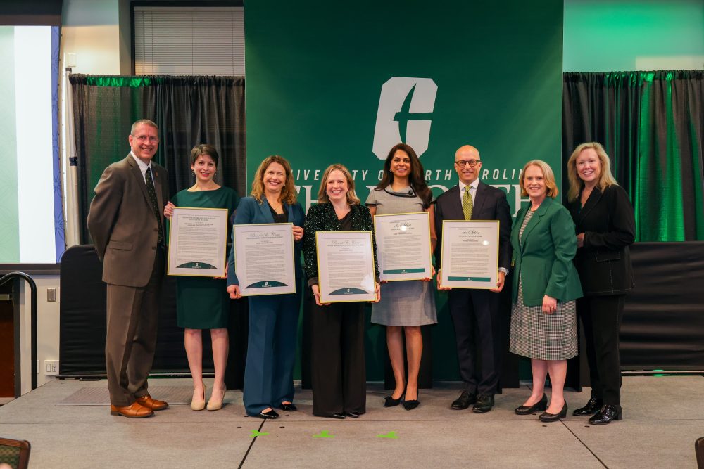 All awardees at the Spring Faculty Awards pose with Chancellor Gaber, Provost Troyer, and Dean Tolone